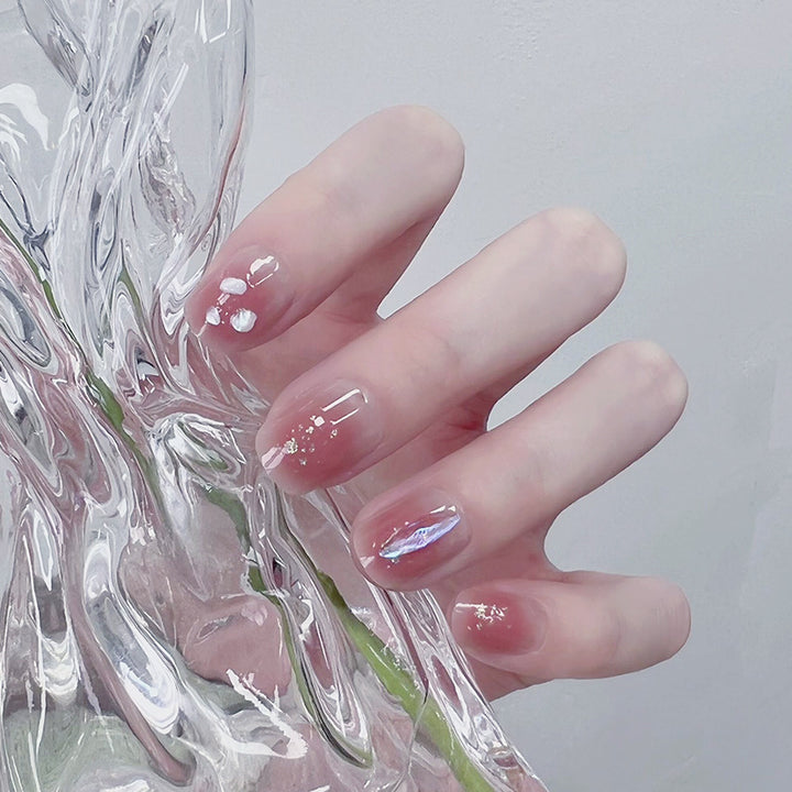 Artificial nails with delicate glitter design and floral accent Stornfield