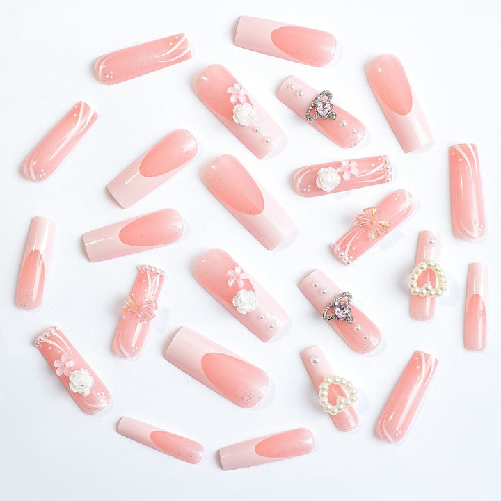 Elegant artificial nail set with glitter and floral accents Stornfield