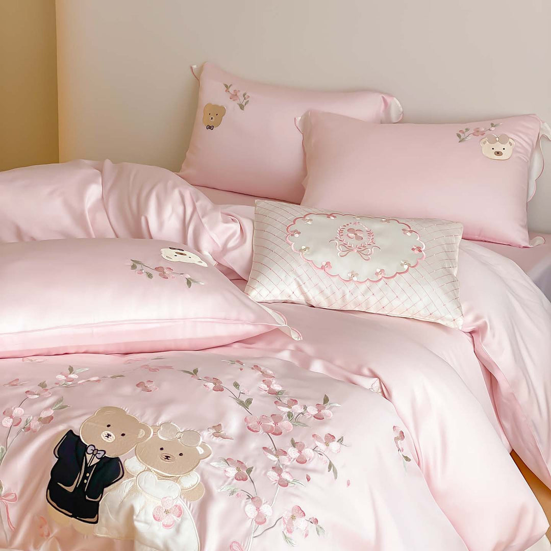 Satin bedding set with embroidered wedding bears, ruffled hem & decorative pillows