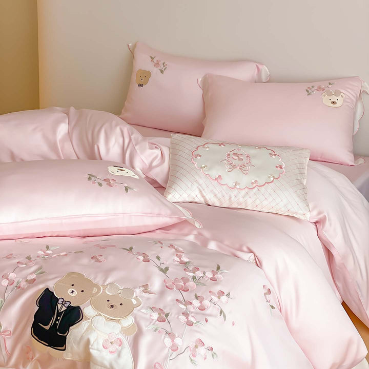 Satin bedding set with embroidered wedding bears, ruffled hem & decorative pillows