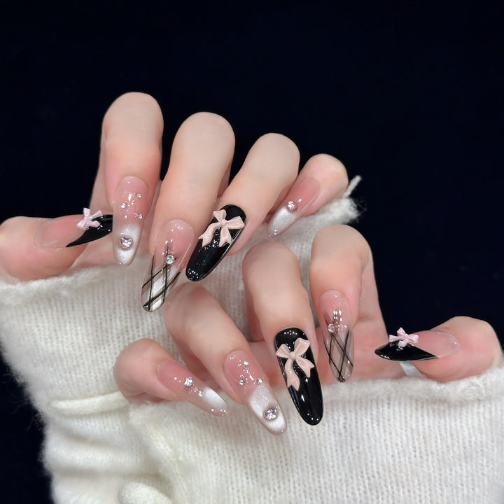 Artificial nail tips with elegant bows and glitter details Stornfield