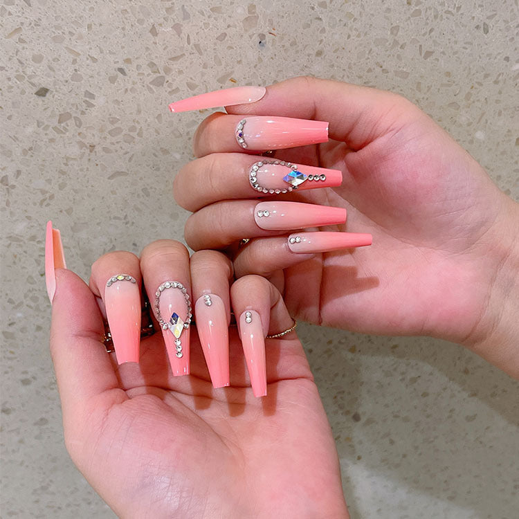 Artificial nails with glitter and stone embellishments Stornfield