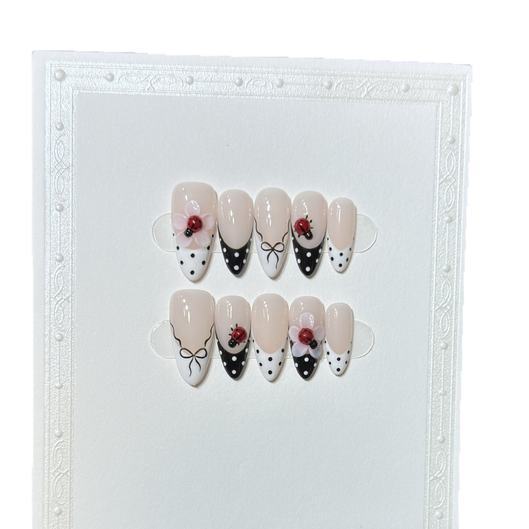 Artistic Stiletto Press-On Nail Set with Floral and Insect Designs Stornfield