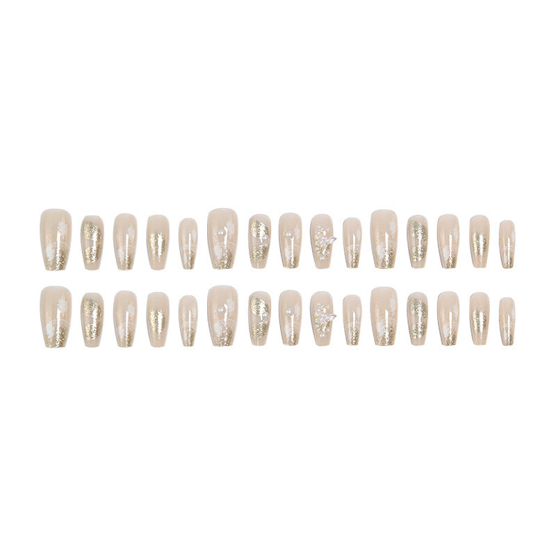 Glamorous artificial nails with heart-shaped accents Stornfield