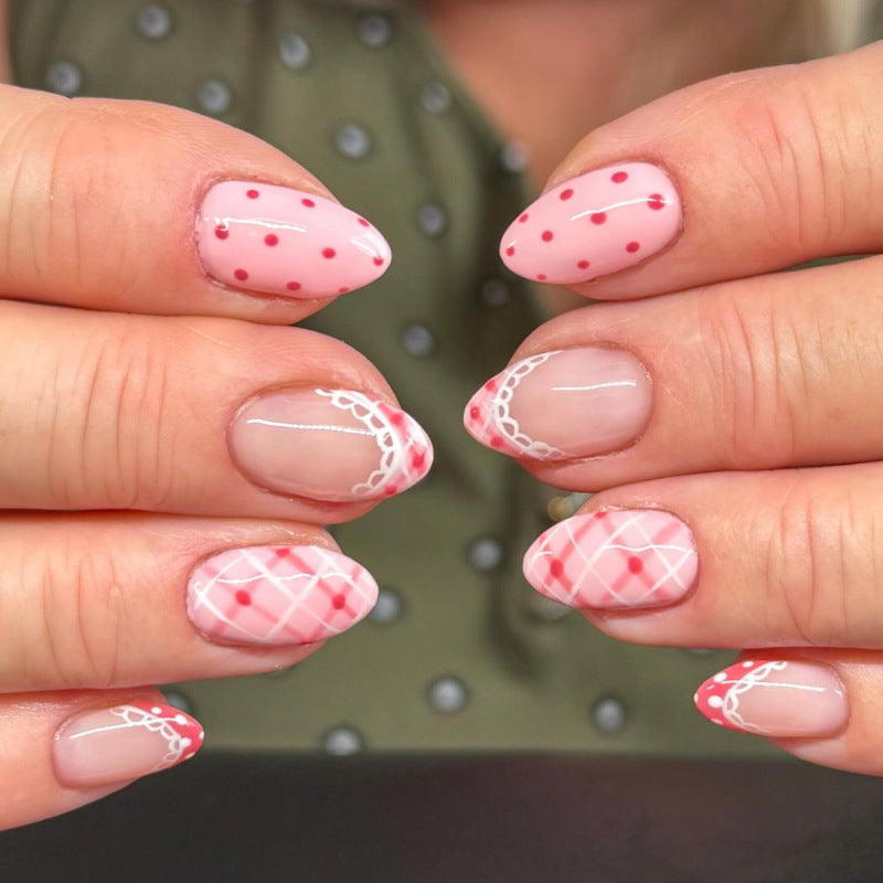 Artificial nail art with playful dots and bows Stornfield