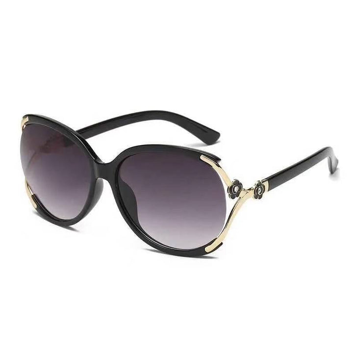 Ladies elegant oversized sunglasses with golden accents Stornfield