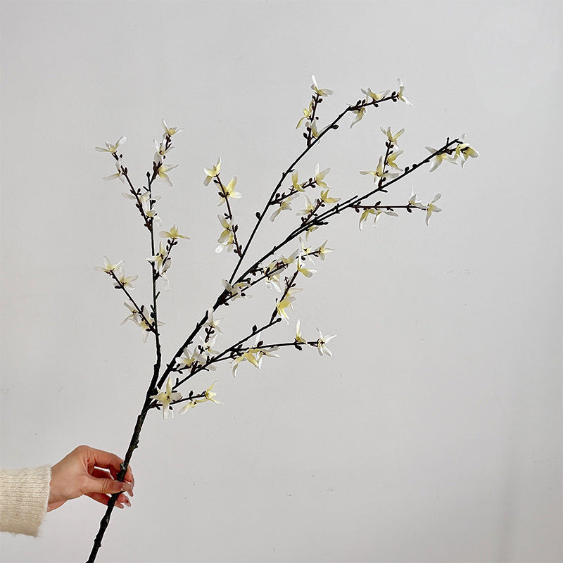 Artificial flower branch with intricately detailed yellow flowers