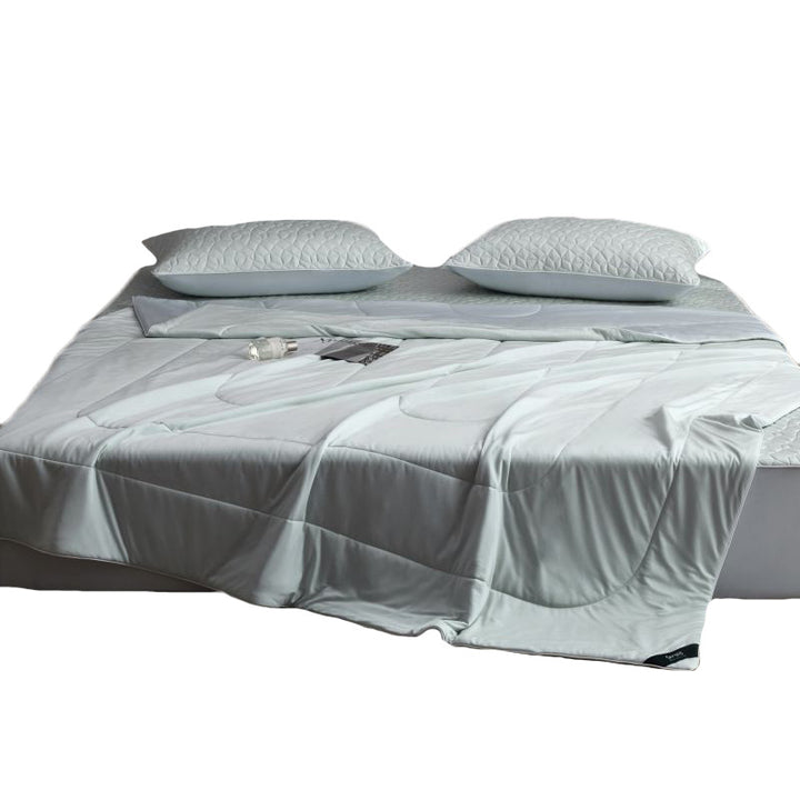 Quilted bedding set with reversible satin blanket and mattress protector