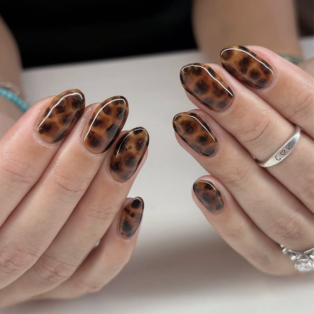 Artificial nail extensions in modern leopard pattern Stornfield