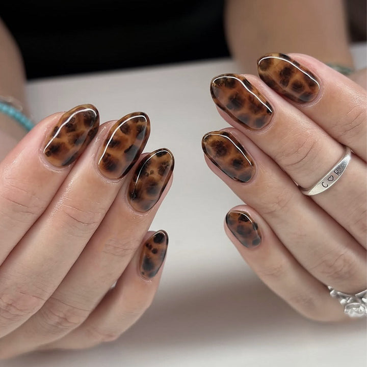 Artificial nail extensions in modern leopard pattern Stornfield