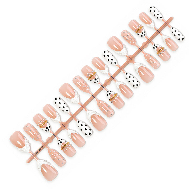 Artificial artificial nails with fashionable dots and embellishments Stornfield