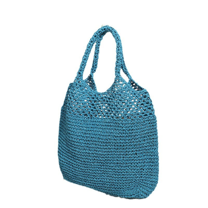 Handcrafted straw bag with wide carrying handle Stornfield