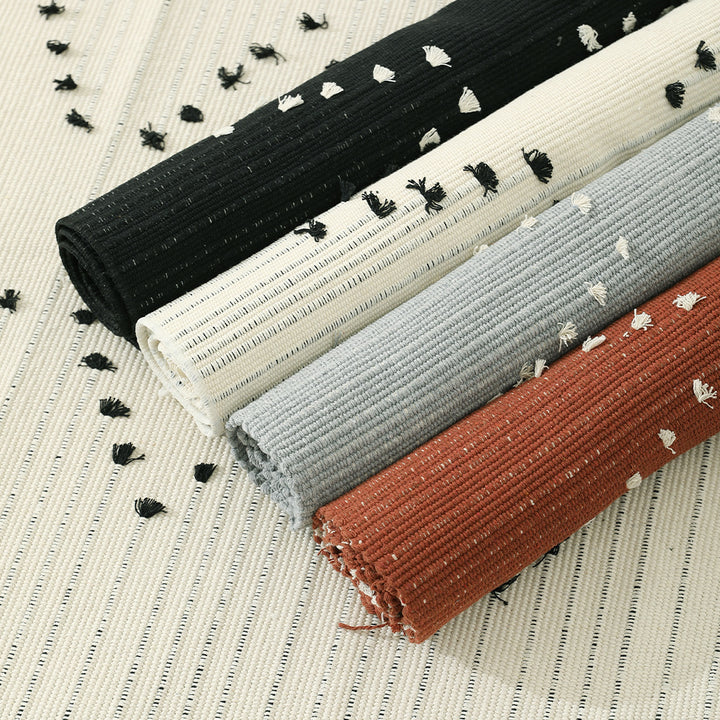 Handwoven cotton rug with dot tuft zigzag and fringed edge