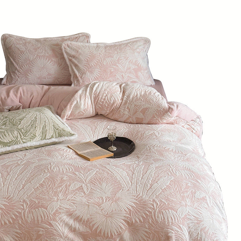 Quilted bed set with jacquard palm pattern and reversible comfort side