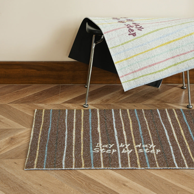 Durable entrance doormat with striped texture and "Welcome" lettering Stornfield