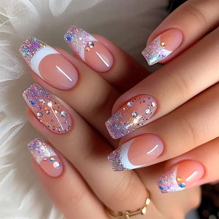 Glamorous artificial nails with glitter and rhinestone embellishments Stornfield