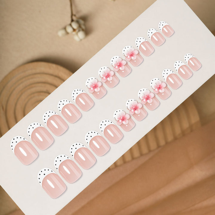Artificial nail set with delicate floral designs and elegant accents Stornfield