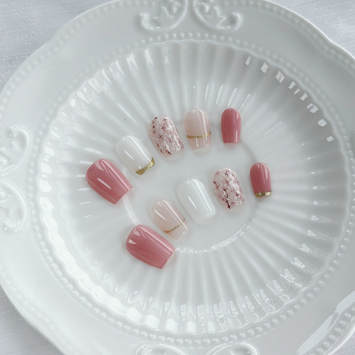 Elegant Press-On Nail Art Set with Gold and Pink Accents