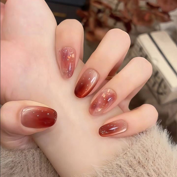 Artificial nails with elegant gradient and golden accents Stornfield