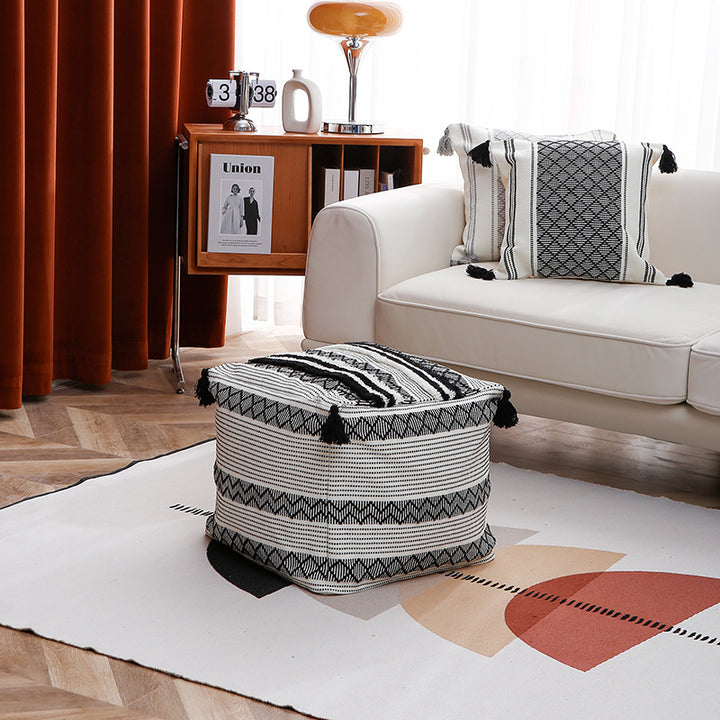 Square Boho seat pouf made of woven cotton blend with tassels and removable cover Stornfield