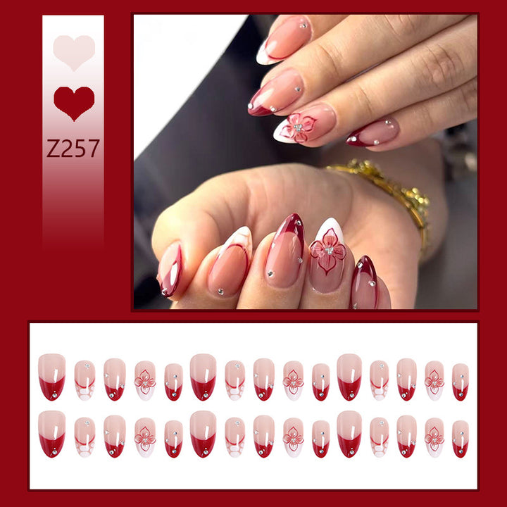Artificial nails with floral and glittering accents Stornfield