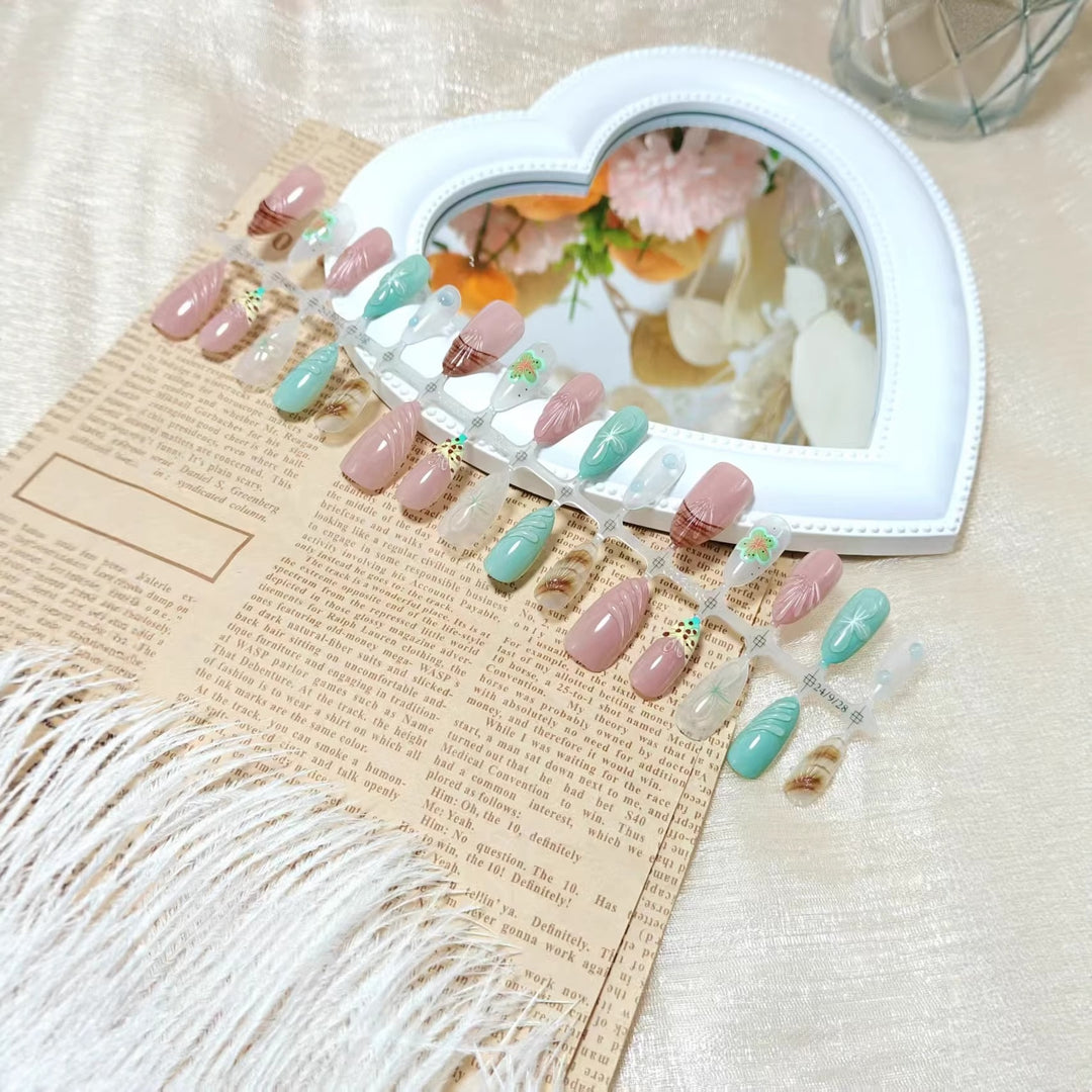 Artificial nail set with exquisite floral designs and shimmering effects Stornfield