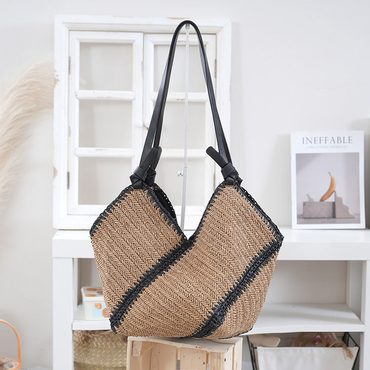 Handbag made of braided natural material with contrasting leather handles Stornfield