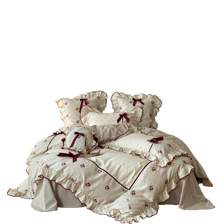 Country house bedding set made of linen-cotton blend with hand-embroidered cherry motifs, ruffles and decorative bows