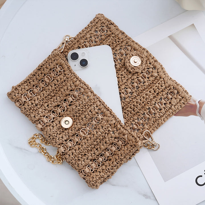 Clutch with chain shoulder strap and handcrafted macrame closure Stornfield