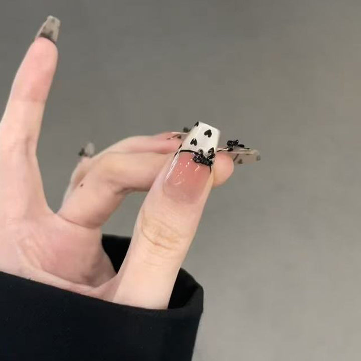 Artistic Press-On Nail Tips with Heart Accents Stornfield