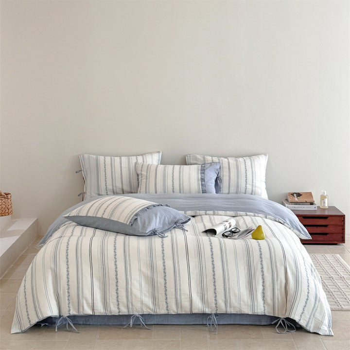 Striped bedding set made of washed linen-cotton mix with fine ribbon embroidery and tie band pillow