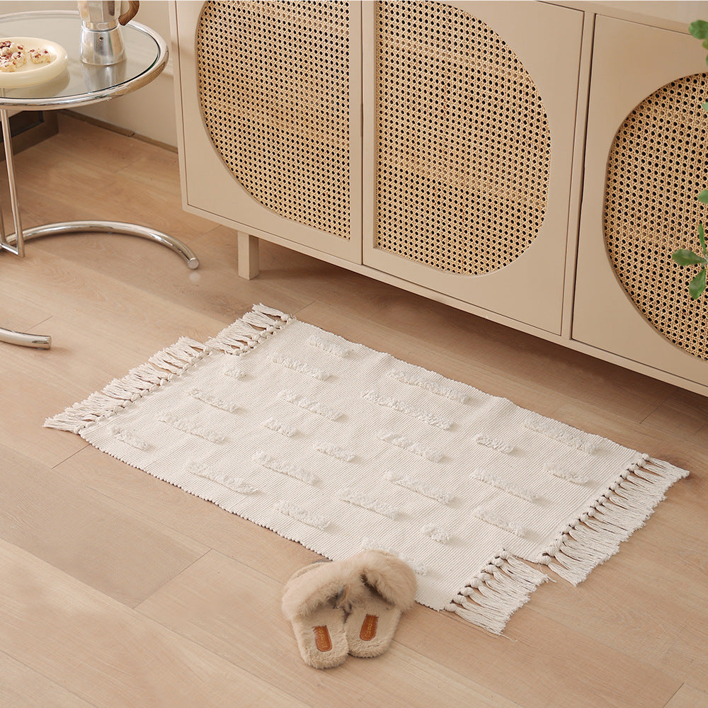 handwoven cotton runner with fringe and embossed relief pattern