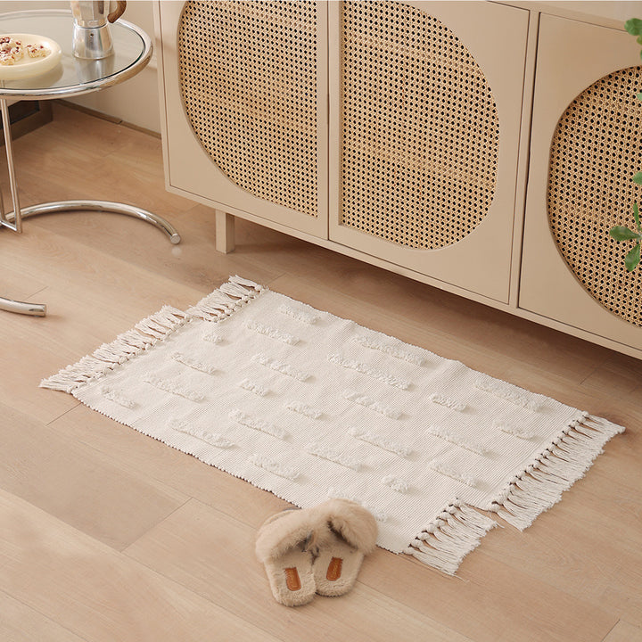 handwoven cotton runner with fringe and embossed relief pattern