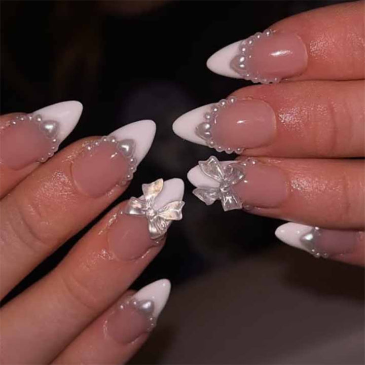 Artful Nail Extensions with Bead and Bow Designs Stornfield