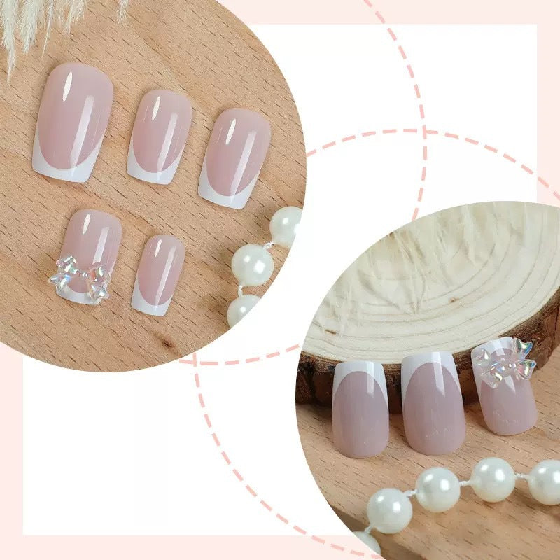Artificial nail set with glamorous French tips and sparkling accents Stornfield