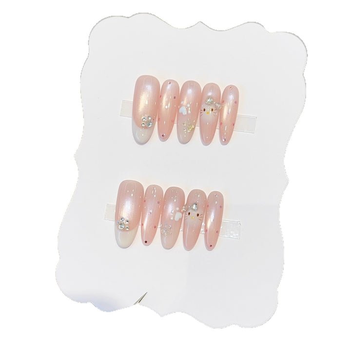 Artificial nail tips with playful penguin and paw print design Stornfield