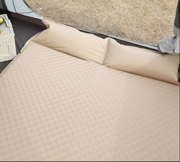 double connectable inflatable camping mattress with integrated dual pillows, egg-crate comfort surface and compact carry sack Stornfield