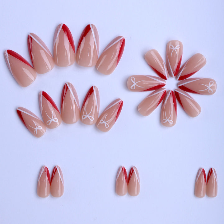 Artificial nails in elegant stiletto design with bow accents Stornfield