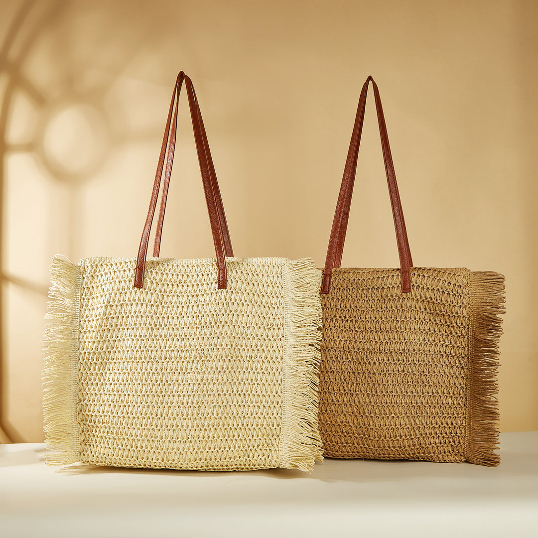 Beach bag made of raffia with fringed details Stornfield
