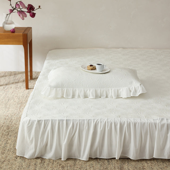 Bedding set with quilted mattress topper and ruffled skirt