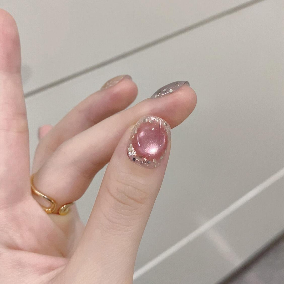 Artificial acrylic nails with shimmering effects and elegant glitter accents Stornfield