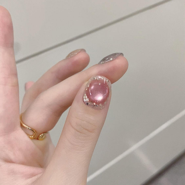 Artificial acrylic nails with shimmering effects and elegant glitter accents Stornfield