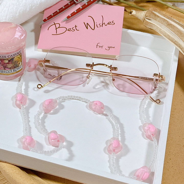Fashionable glasses strap with heart pendants Stornfield