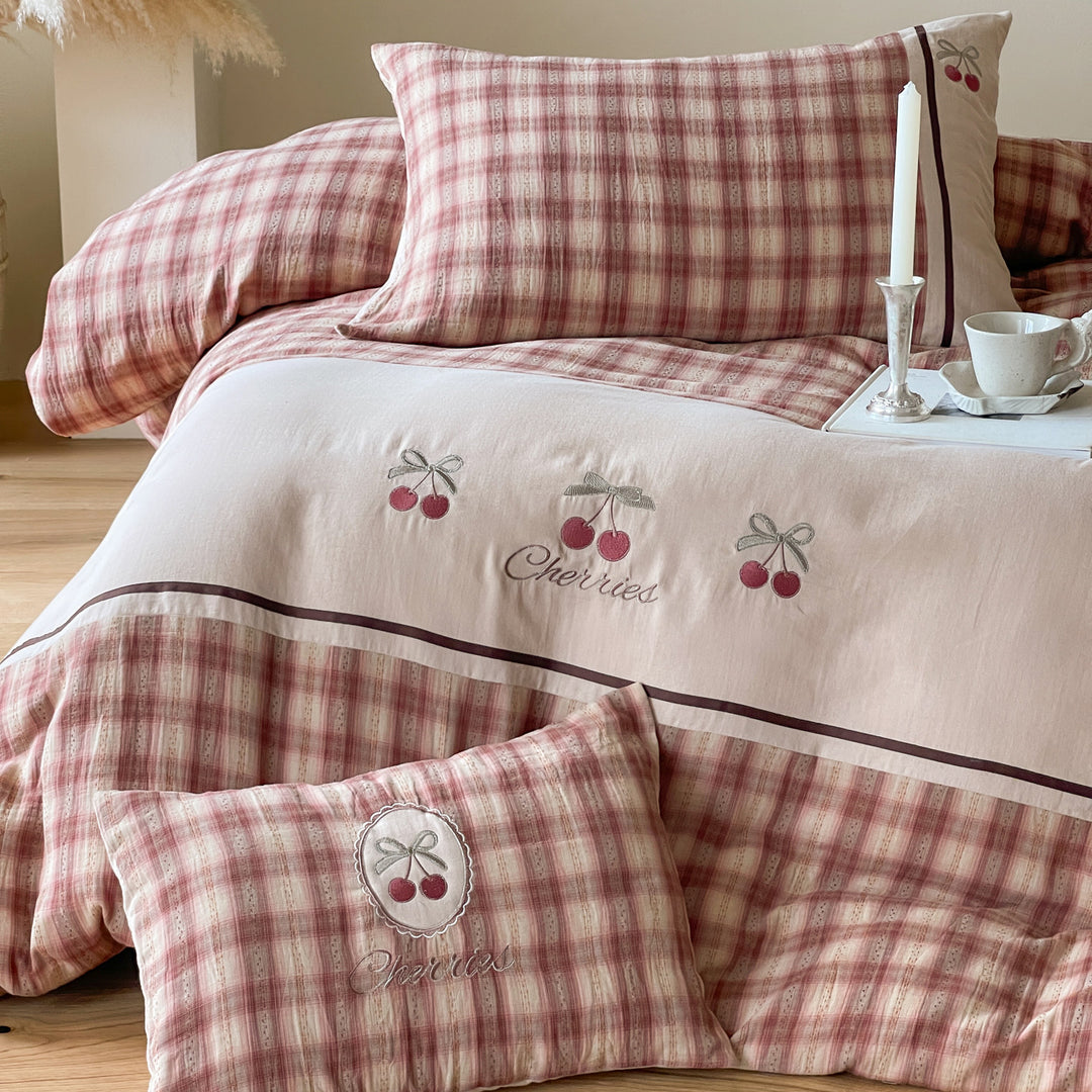 Luxurious cotton bedding set with check pattern and embroidered floral appliqués