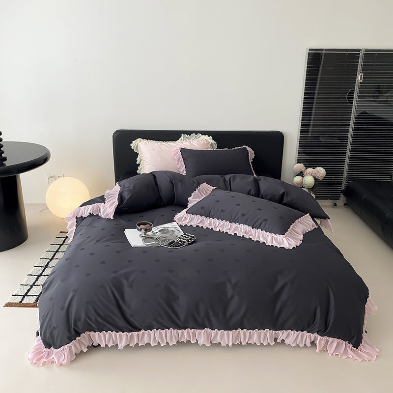 Elegant reversible bedding with romantic ruffle trim and subtle polka dot relief