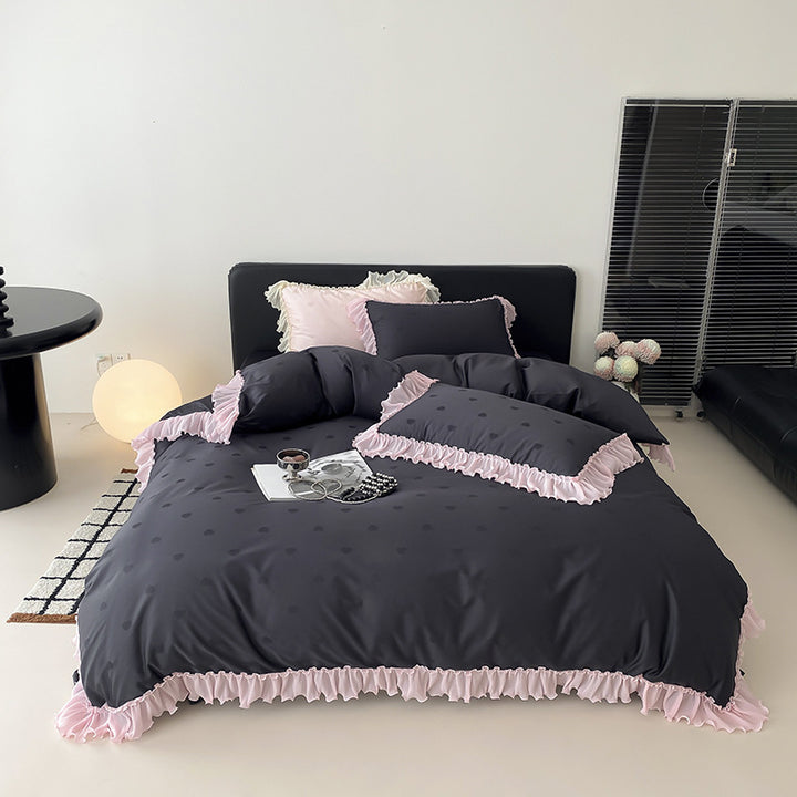 Elegant reversible bedding with romantic ruffle trim and subtle polka dot relief