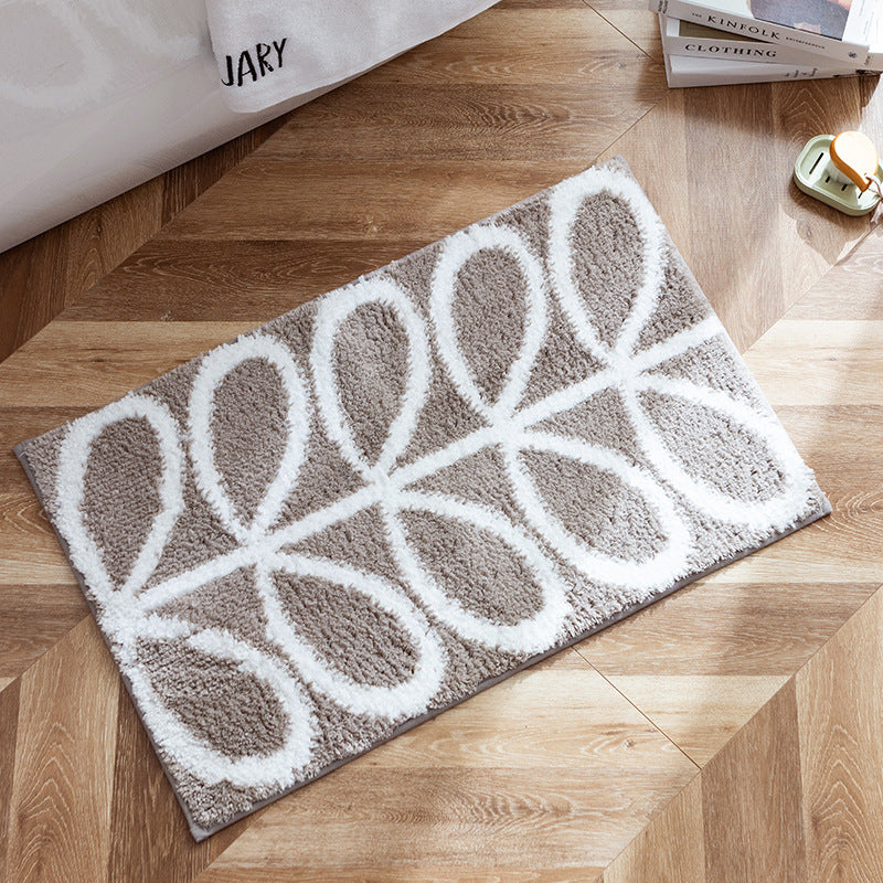 Fluffy bath mat in a graphic wave relief with anti-slip base Stornfield