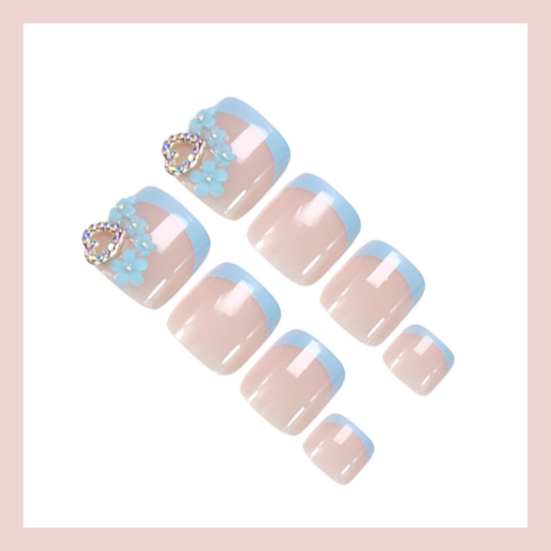 Nail art set with elegant flower and glitter accents Stornfield