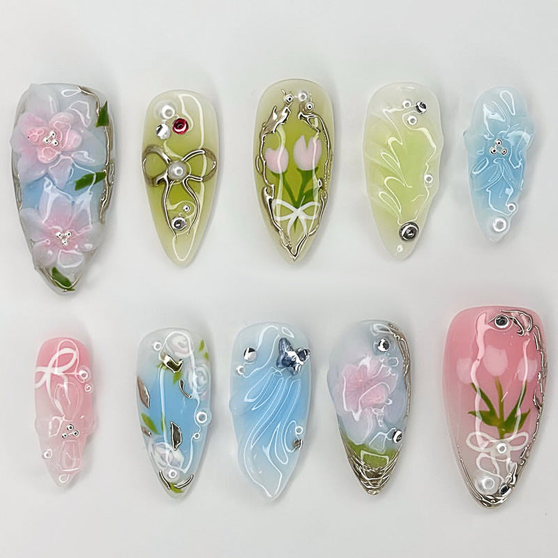 Acrylic nail set with handcrafted floral designs and glitter accents Stornfield