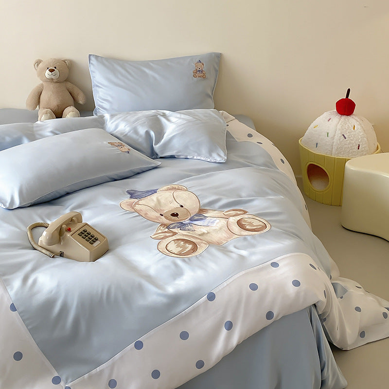 Reversible satin bedding set for children with a large watercolor teddy, polka dot border, and silky-matte finish